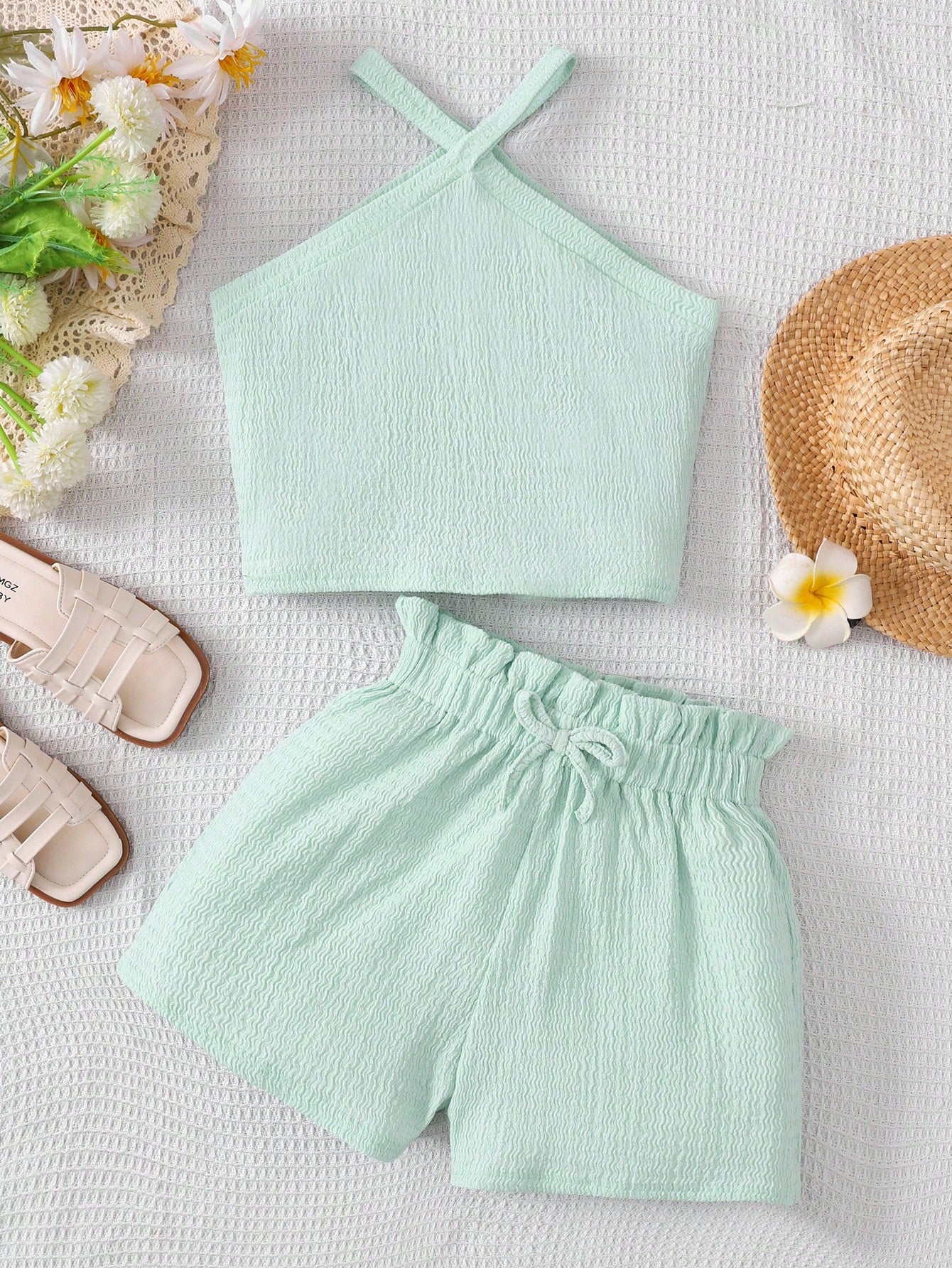 Tween girl 2-piece casual outfit set featuring a solid beige knit halter sleeveless top with belted detail and matching shorts.