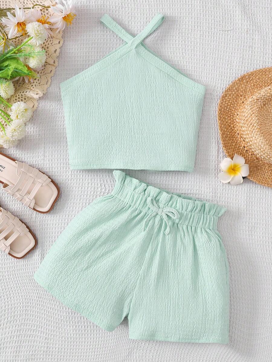 Tween girl 2-piece casual outfit set featuring a solid beige knit halter sleeveless top with belted detail and matching shorts.