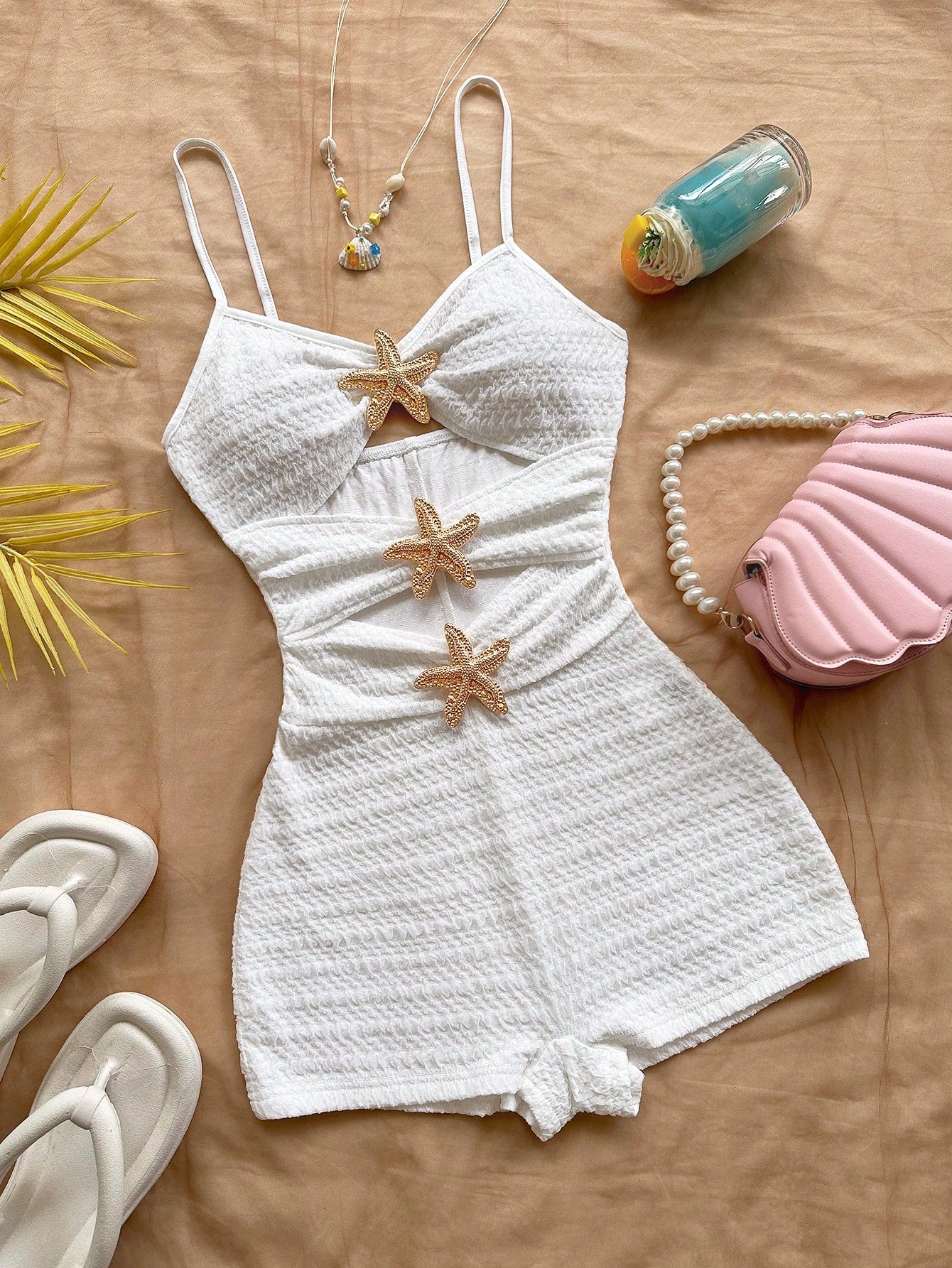 Apricot one-piece swimsuit for tween girls with a halter neckline, ruffle trim, textured knit fabric, fitted shape, and starfish metal decor.