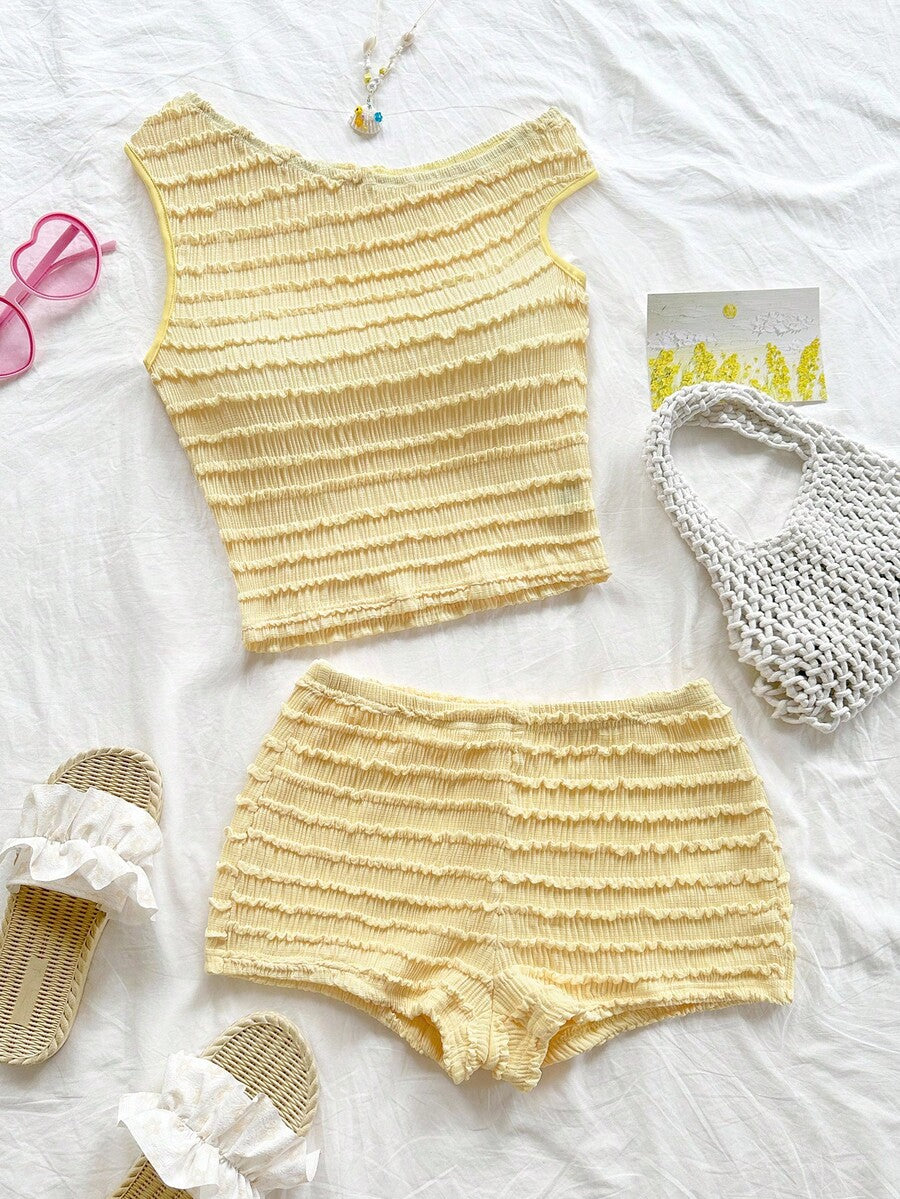 Tween girls 2-piece summer clothing set featuring a black asymmetric rib-knit striped off-shoulder t-shirt and matching slim fit shorts.