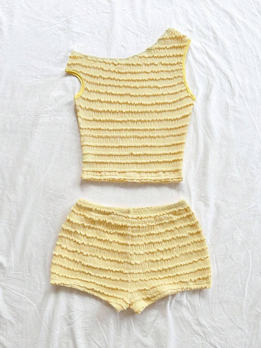 Tween girls 2-piece summer clothing set featuring a black asymmetric rib-knit striped off-shoulder t-shirt and matching slim fit shorts.
