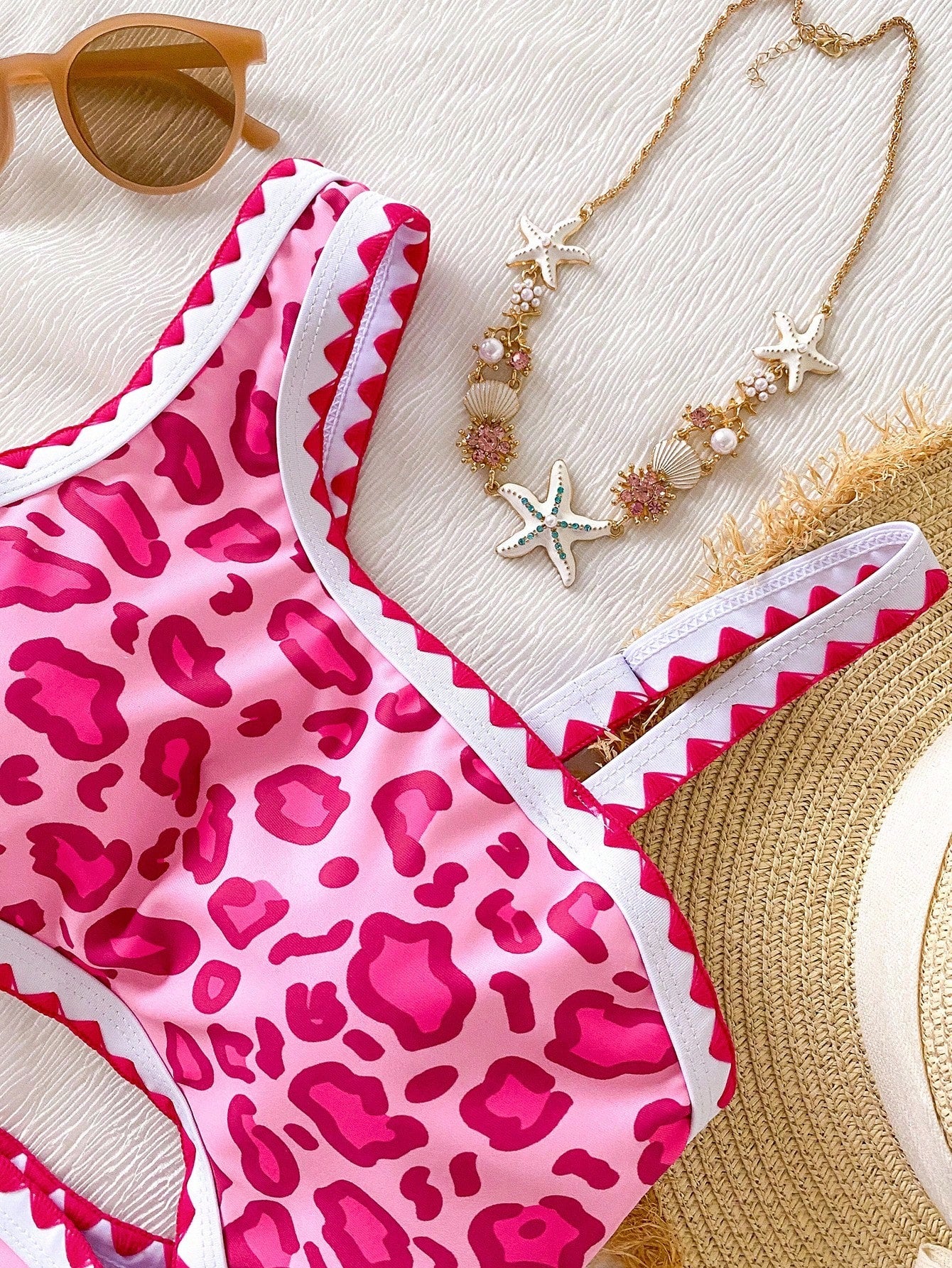Tween girls one-piece swimsuit featuring an asymmetric neckline, pendant decor, plain design, wireless bra, high-cut bottom, and medium-stretch fabric.