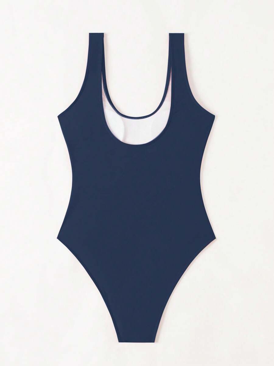 Women's solid color one-piece swimsuit featuring a backless scoop neck design and high cut fit