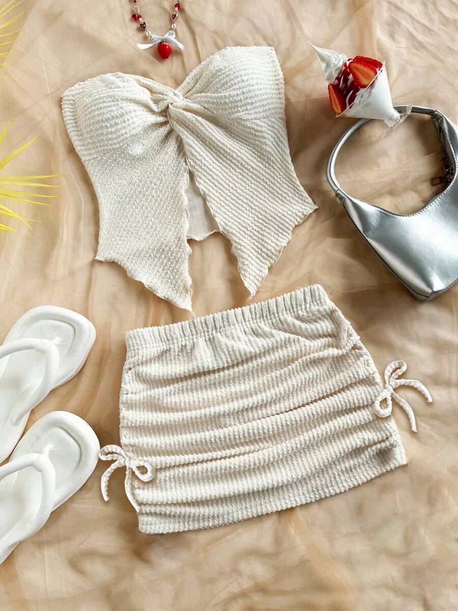 Tween girls apricot two-piece set featuring a spaghetti strap tank top and skirt with ruched lettuce trim.