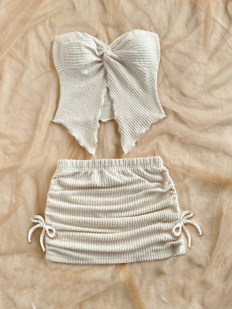 Tween girls apricot two-piece set featuring a spaghetti strap tank top and skirt with ruched lettuce trim.