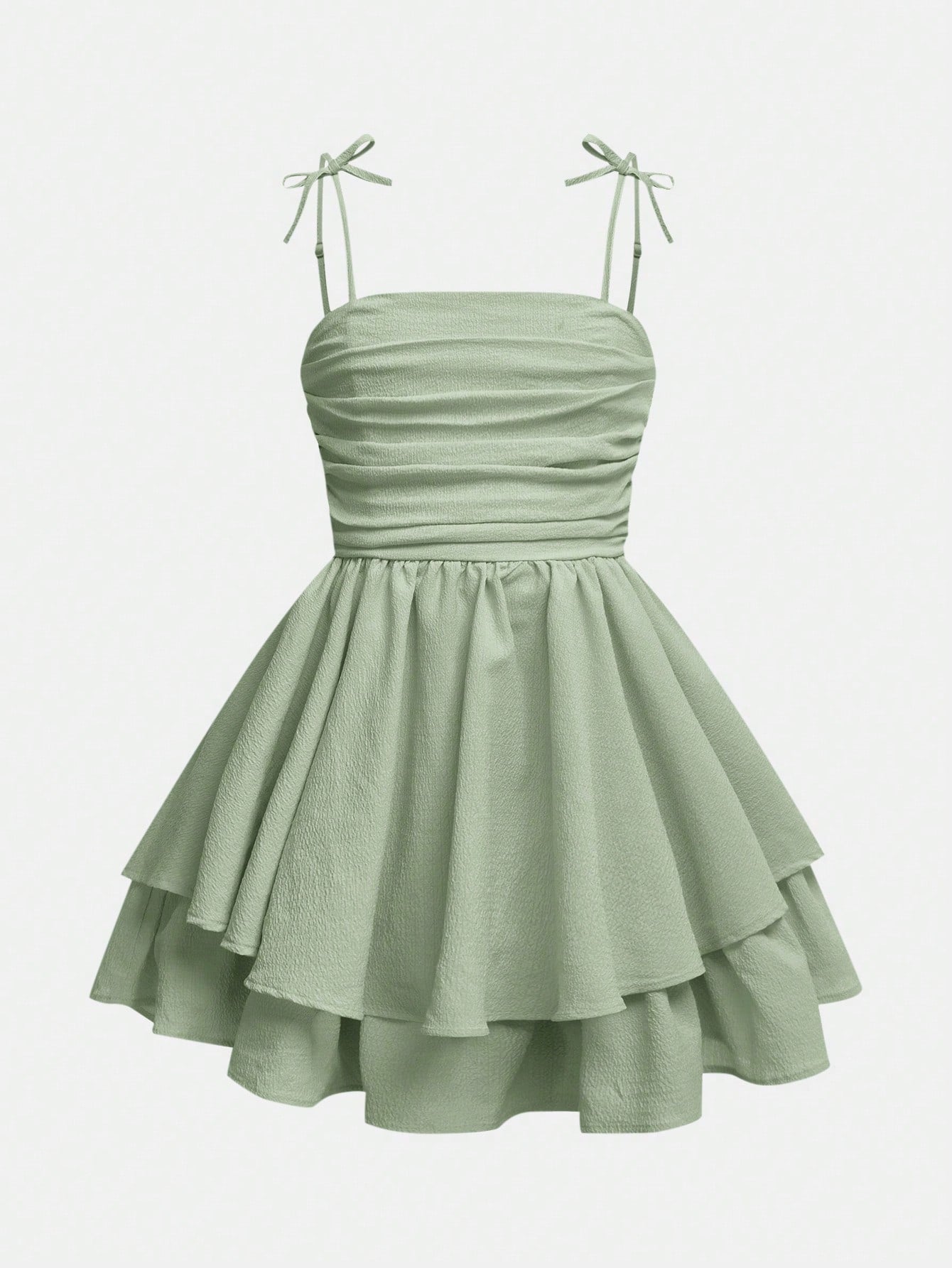 Tween girls apricot tiered cami dress with spaghetti straps, high waist, and slim fit layered hem.
