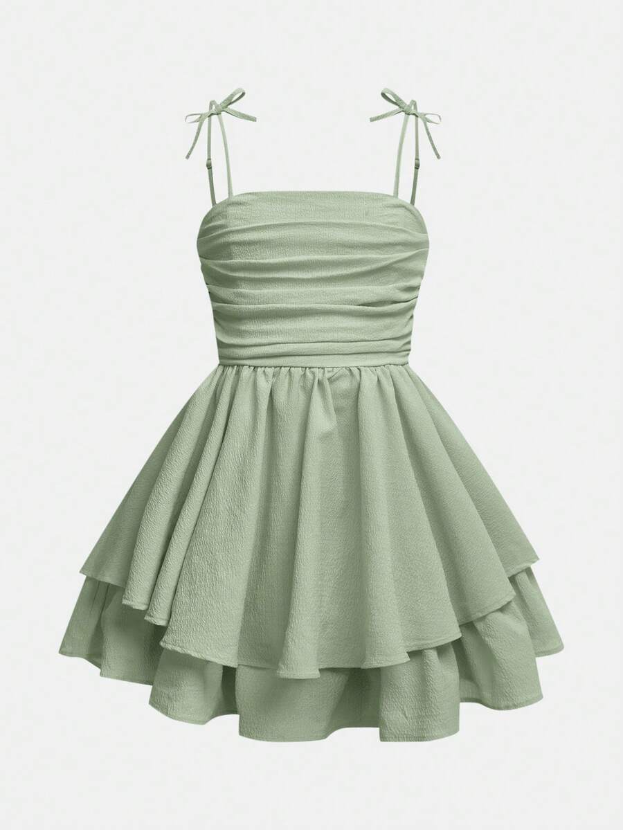 Tween girls apricot tiered cami dress with spaghetti straps, high waist, and slim fit layered hem.