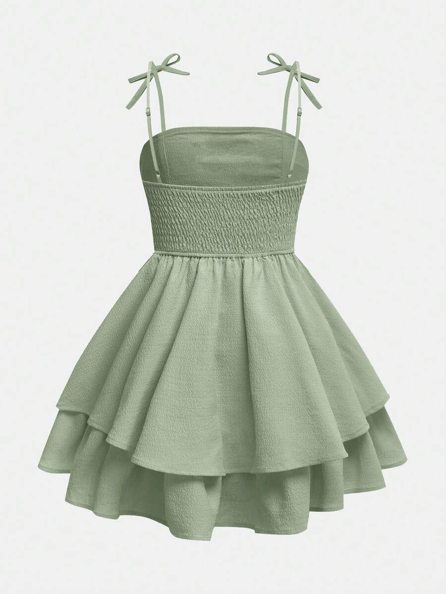 Tween girls apricot tiered cami dress with spaghetti straps, high waist, and slim fit layered hem.