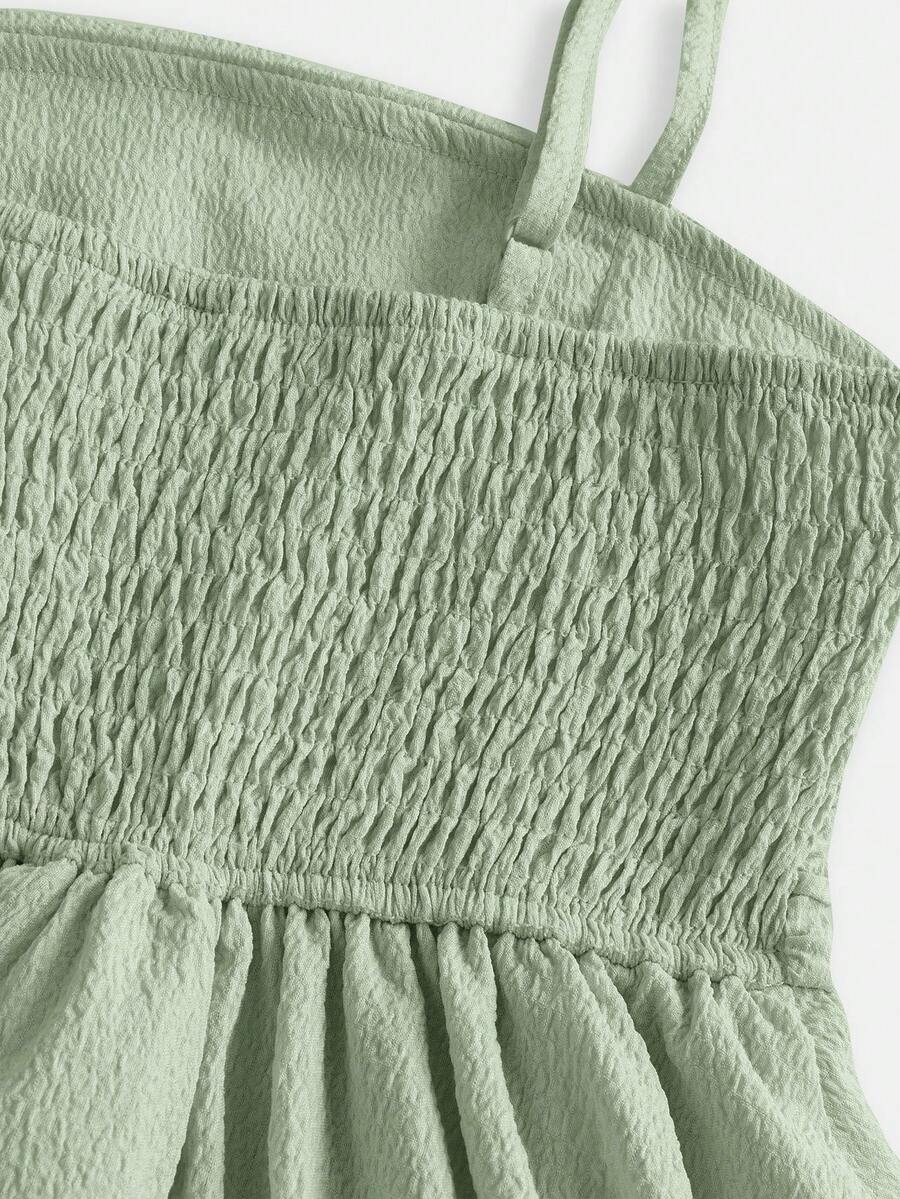 Tween girls apricot tiered cami dress with spaghetti straps, high waist, and slim fit layered hem.