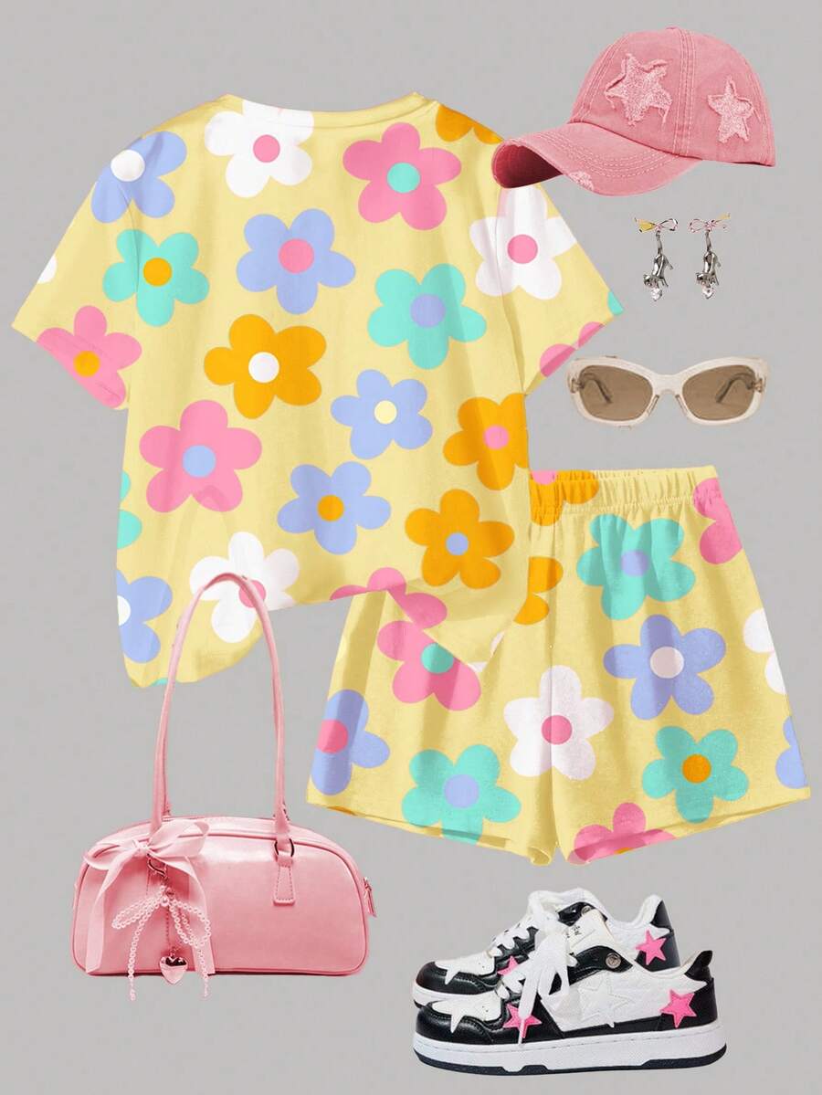 Tween girls multicolor tie-dye 2-piece outfit set featuring a drop-shoulder short-sleeve t-shirt and matching loose track shorts with side pockets.