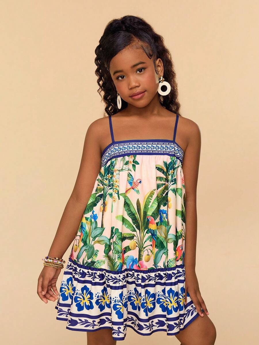 Beige tween girls sleeveless cami dress with spaghetti straps, fruit and vegetable print, high waist, and flared short hem