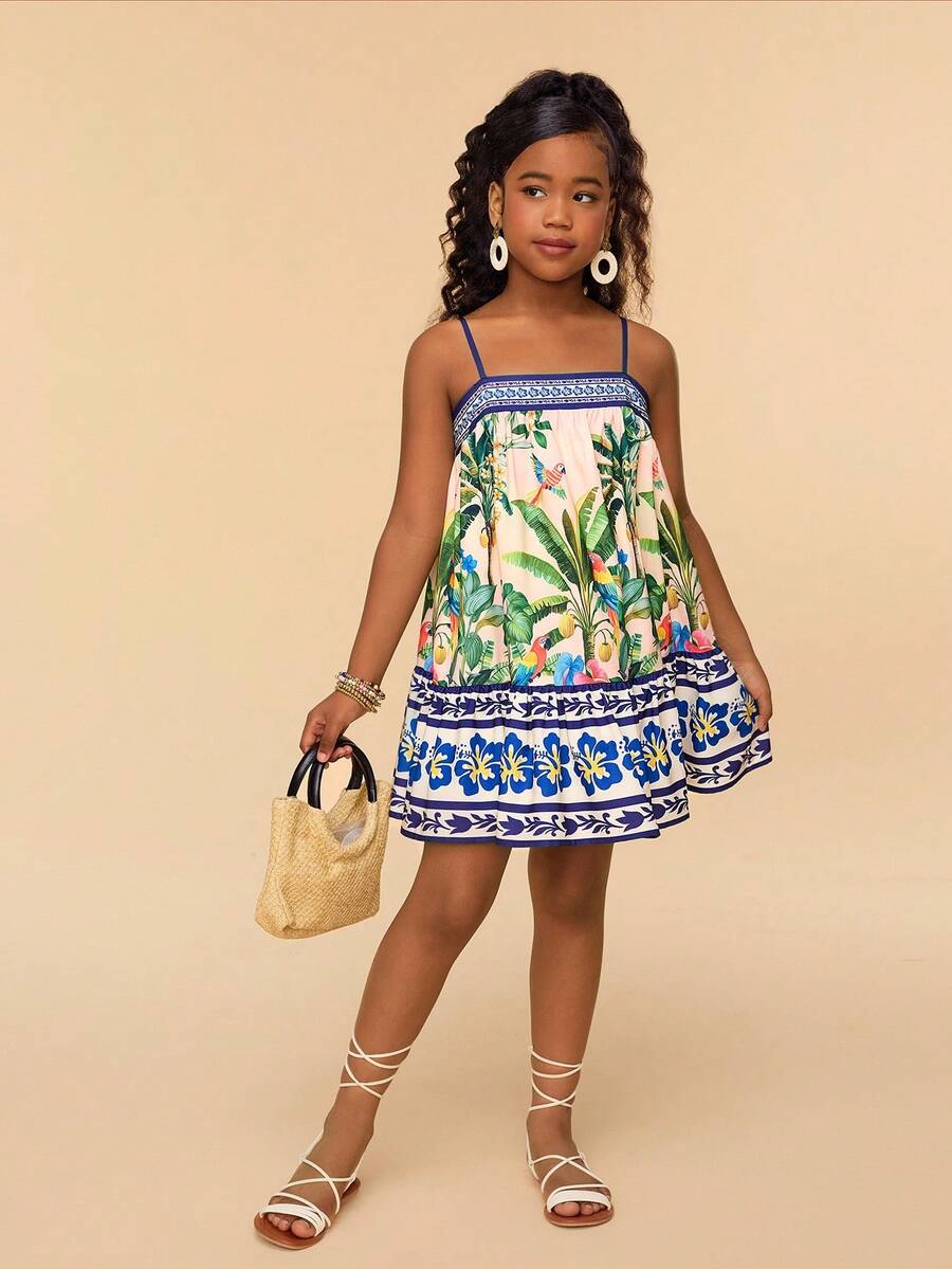 Beige tween girls sleeveless cami dress with spaghetti straps, fruit and vegetable print, high waist, and flared short hem
