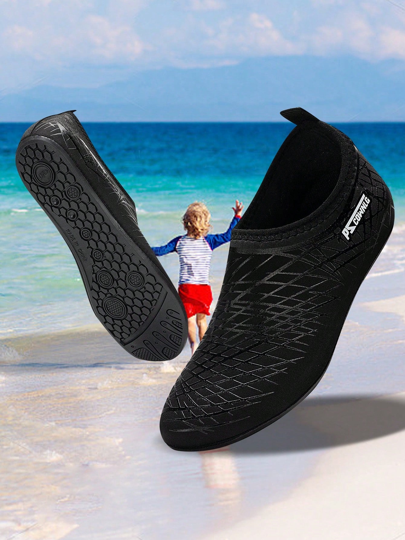 Black slip-on kids water shoes with a graphic pattern fabric upper and wear-resistant rubber outsole for boys and girls.