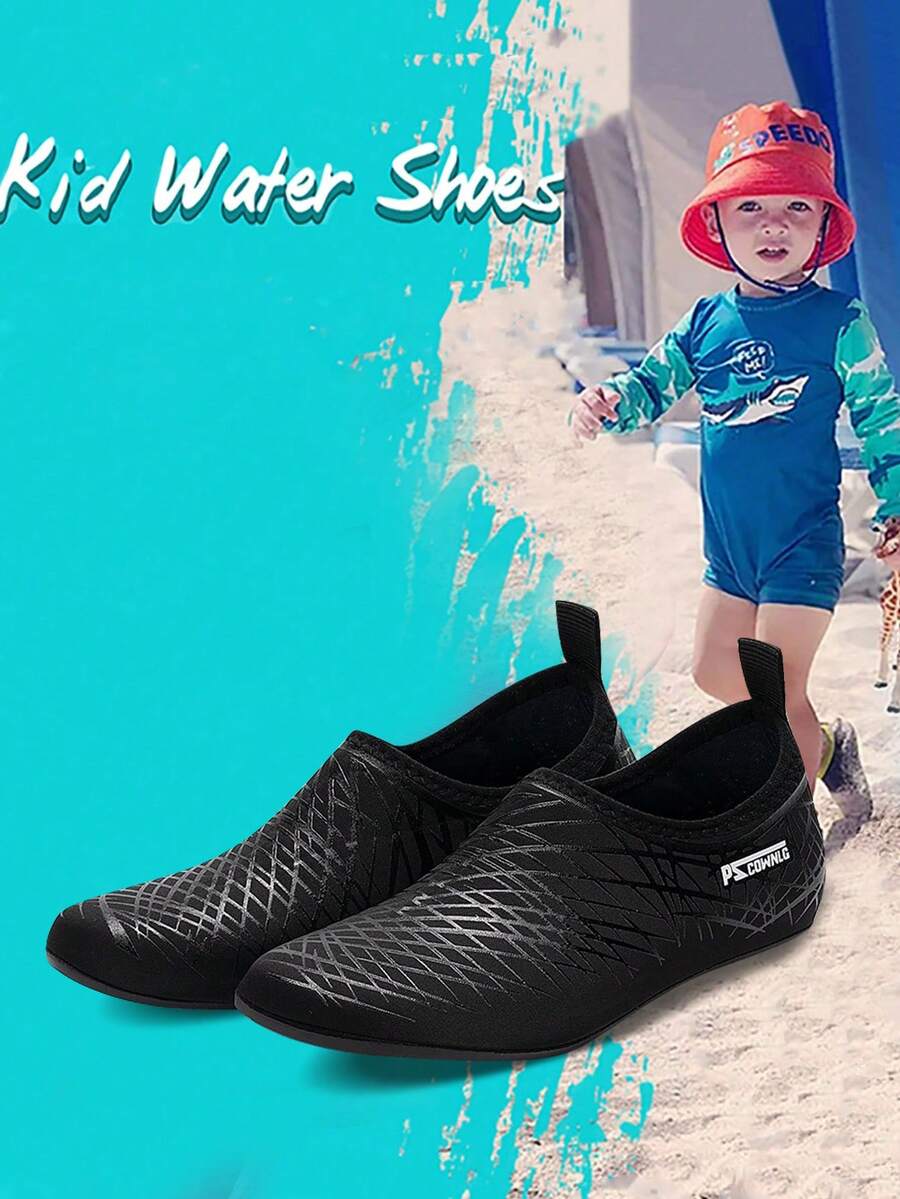 Black slip-on kids water shoes with a graphic pattern fabric upper and wear-resistant rubber outsole for boys and girls.