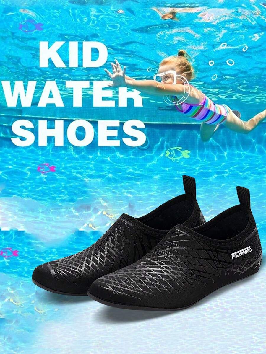 Black slip-on kids water shoes with a graphic pattern fabric upper and wear-resistant rubber outsole for boys and girls.
