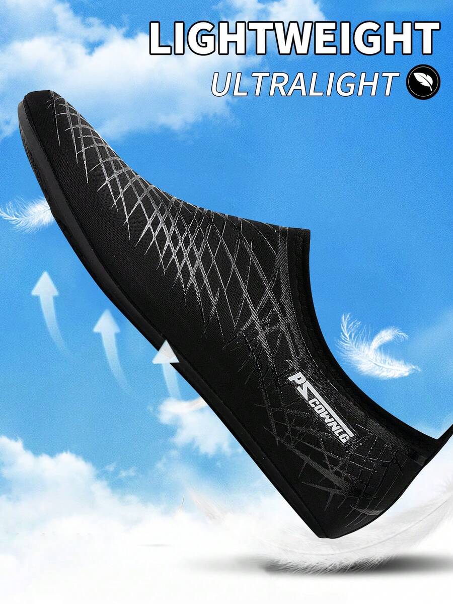 Black slip-on kids water shoes with a graphic pattern fabric upper and wear-resistant rubber outsole for boys and girls.