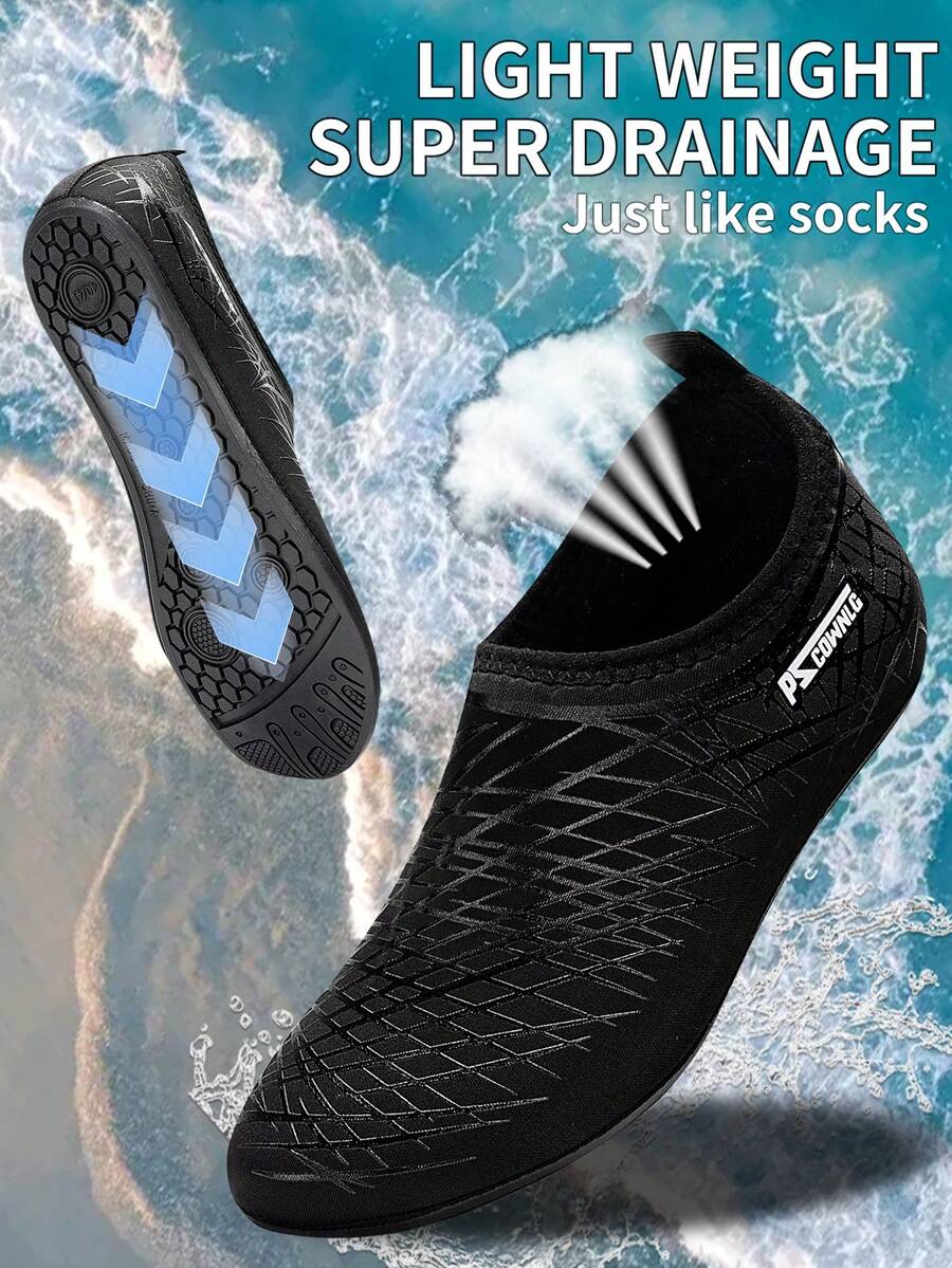 Black slip-on kids water shoes with a graphic pattern fabric upper and wear-resistant rubber outsole for boys and girls.