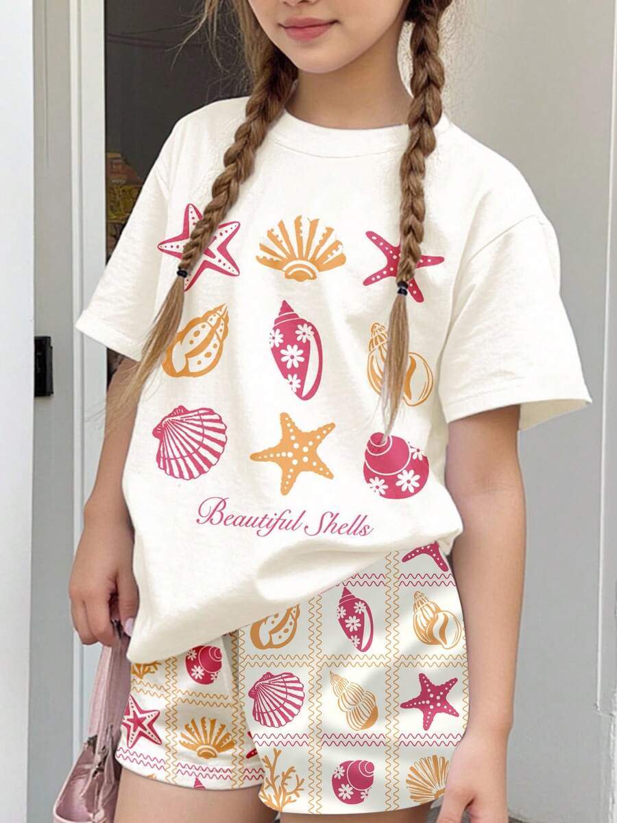 Tween girls 2-piece summer casual outfit featuring a multicolor seashell print short sleeve T-shirt with drop shoulders and matching loose fit shorts with pockets.
