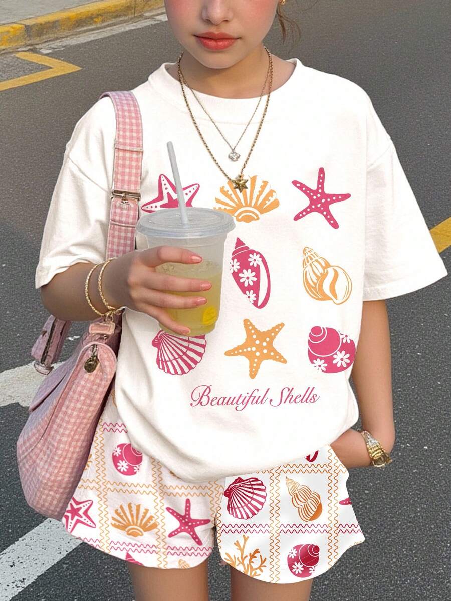 Tween girls 2-piece summer casual outfit featuring a multicolor seashell print short sleeve T-shirt with drop shoulders and matching loose fit shorts with pockets.