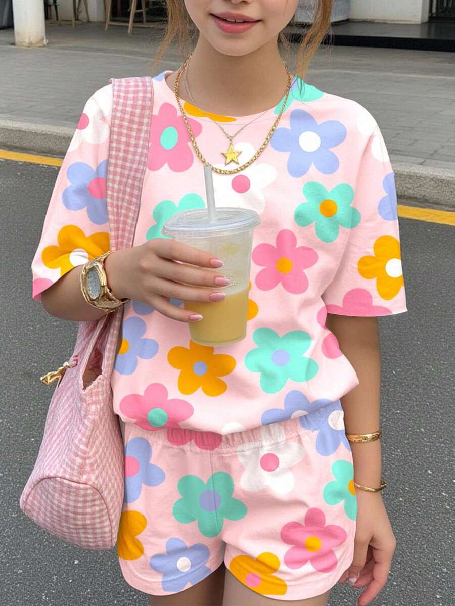 Tween girls multicolor tie-dye 2-piece outfit set featuring a drop-shoulder short-sleeve t-shirt and matching loose track shorts with side pockets.