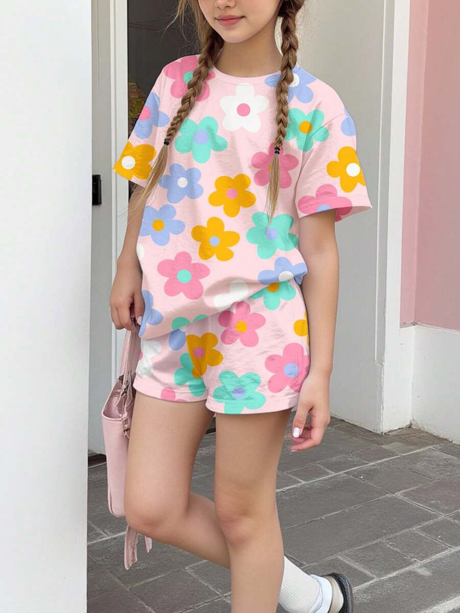 Tween girls multicolor tie-dye 2-piece outfit set featuring a drop-shoulder short-sleeve t-shirt and matching loose track shorts with side pockets.