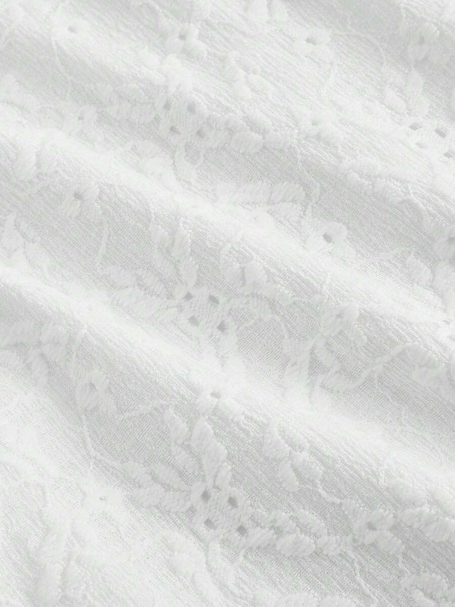 White eyelet lace A-line mini dress for tween girls with short puff sleeves, sweetheart neckline, high waist, and flared hem