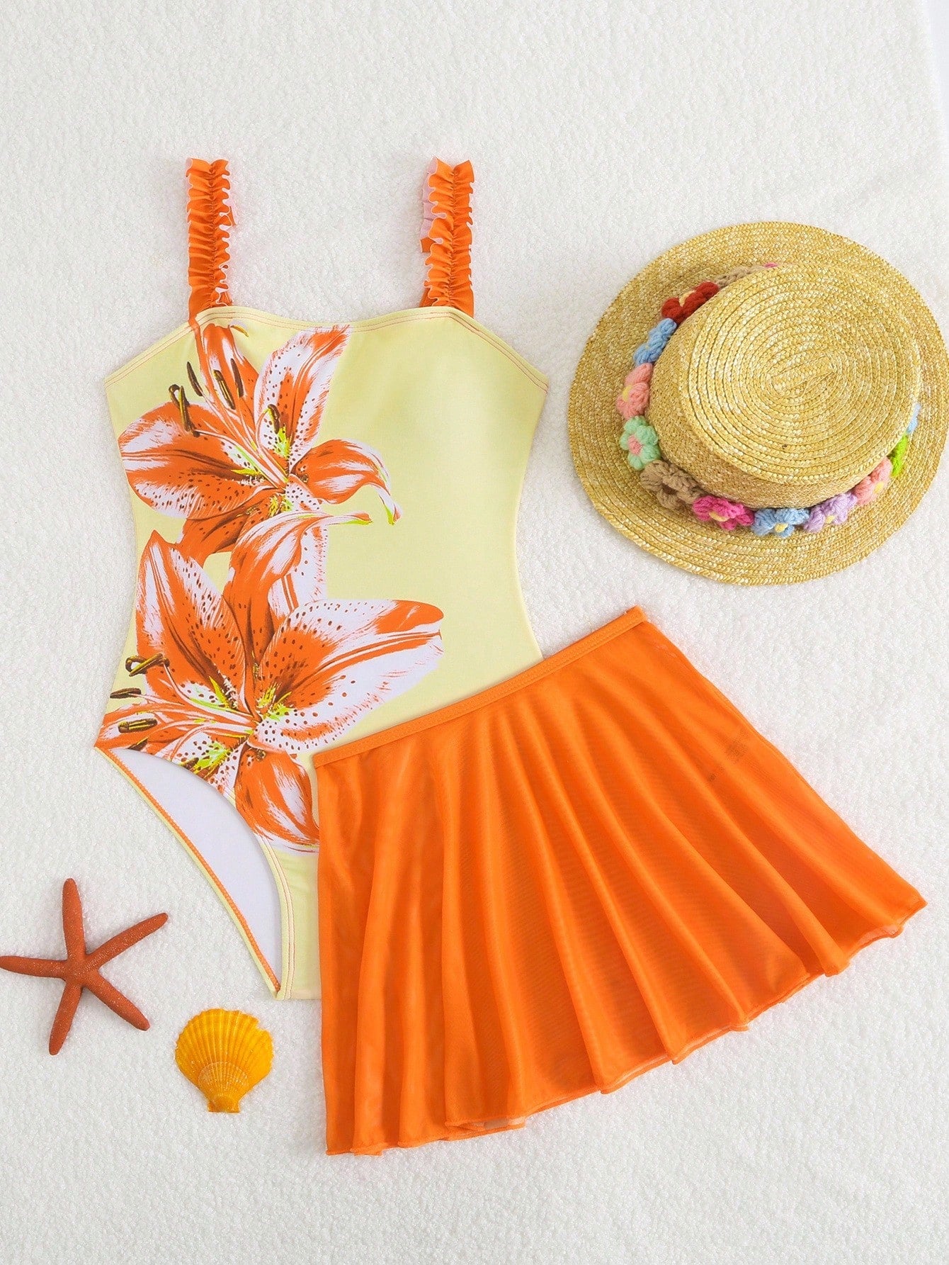 Girls floral print swimsuit set with strap neckline, sleeveless fitted top, and pleated mesh skirt bottom for beach and summer vacation wear.