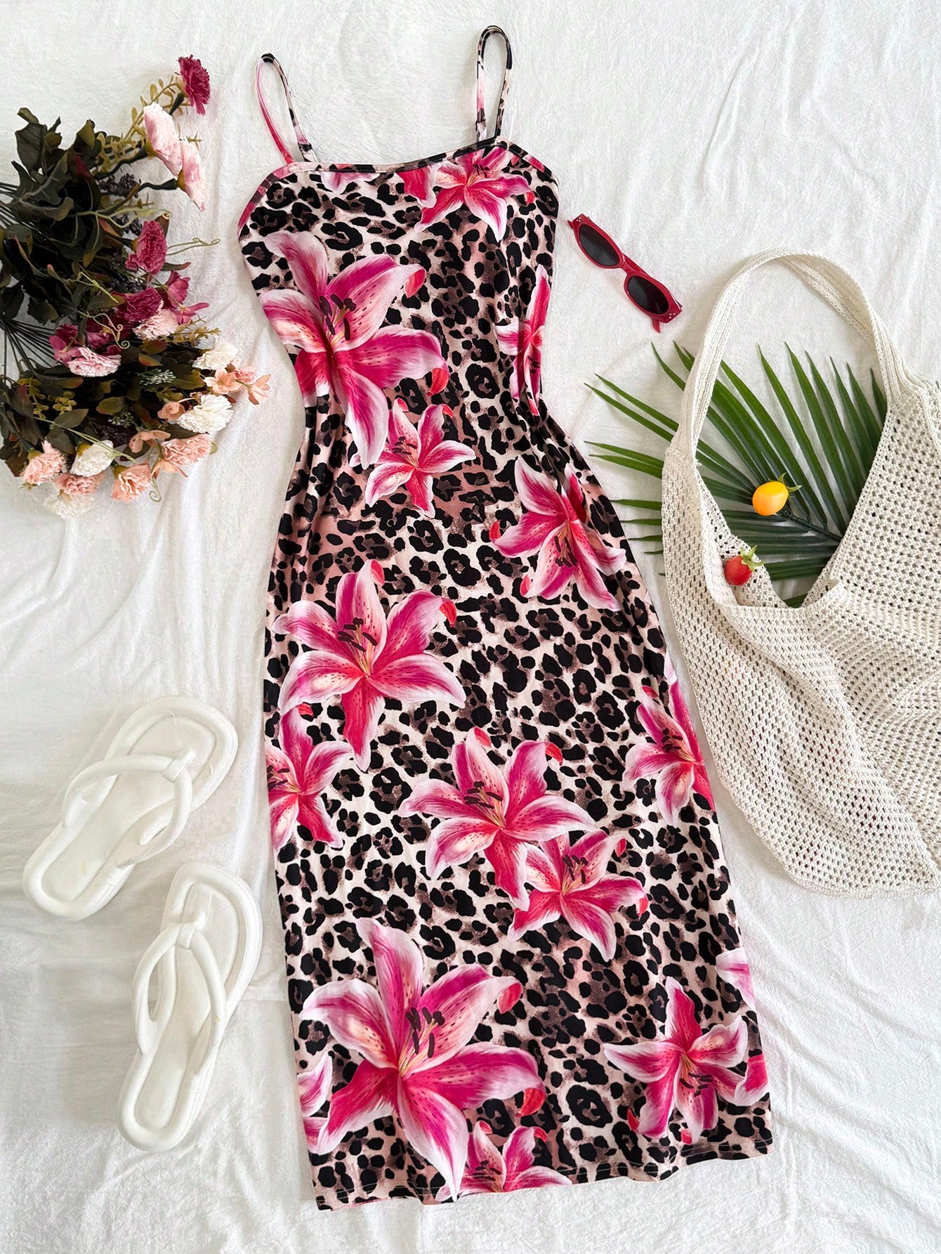 Tween girls black cami midi dress featuring plant print, spaghetti straps, slim fit, and a flared hem.