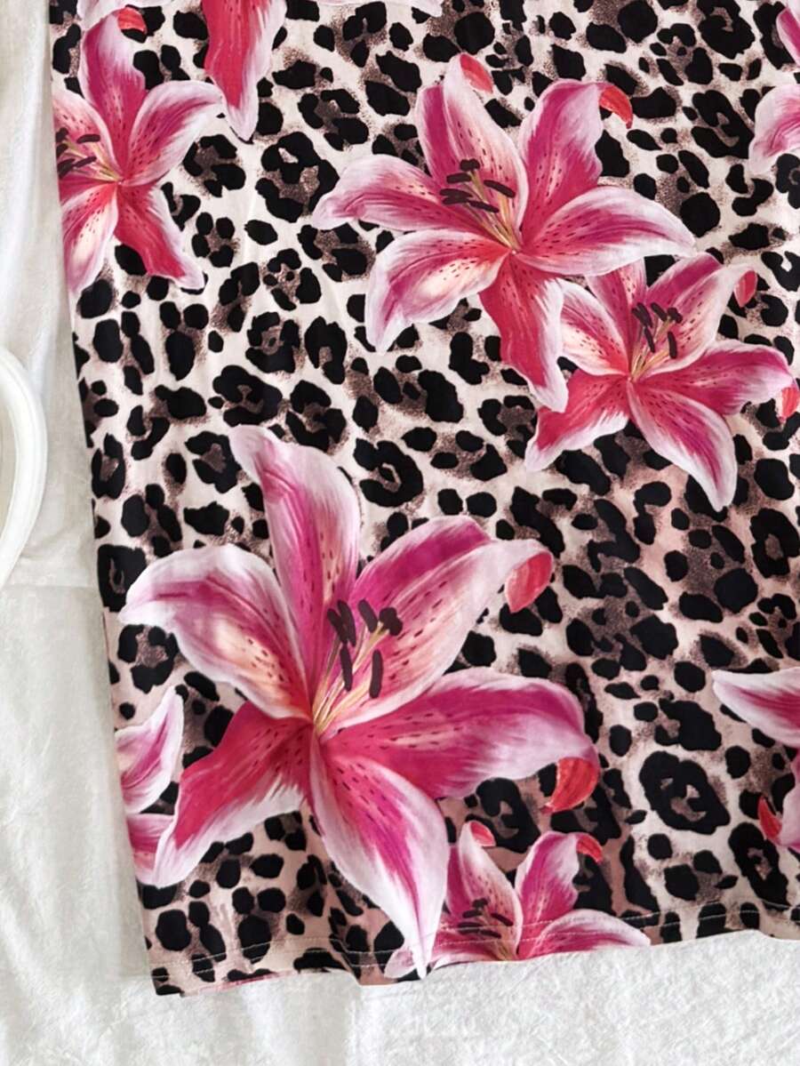 Tween girls black cami midi dress featuring plant print, spaghetti straps, slim fit, and a flared hem.