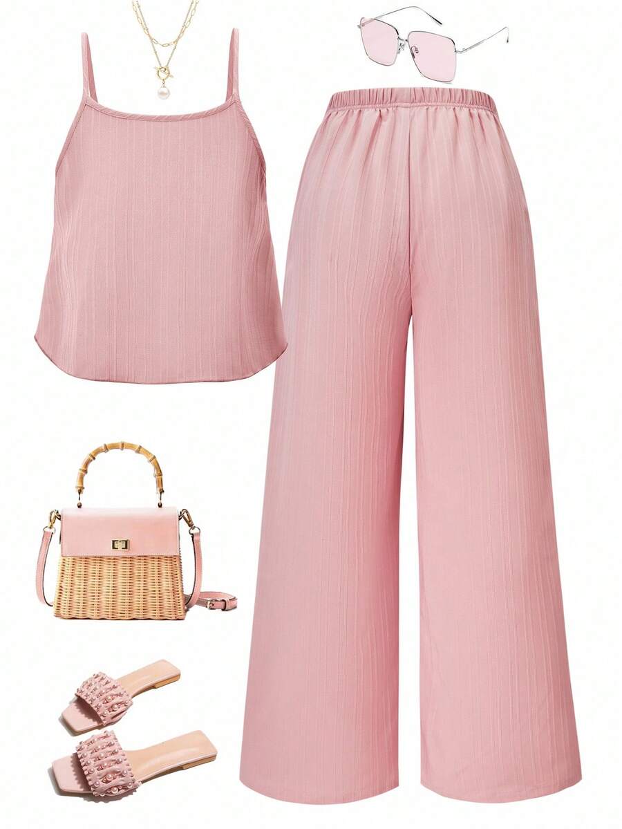 Tween girl wearing an apricot 2-piece outfit set featuring a shirred spaghetti strap short cami top and matching wide-leg long pants.