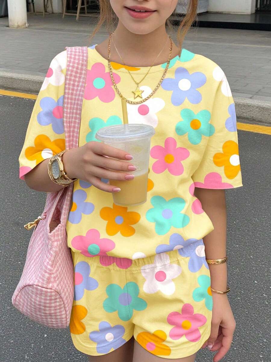 Tween girls multicolor tie-dye 2-piece outfit set featuring a drop-shoulder short-sleeve t-shirt and matching loose track shorts with side pockets.