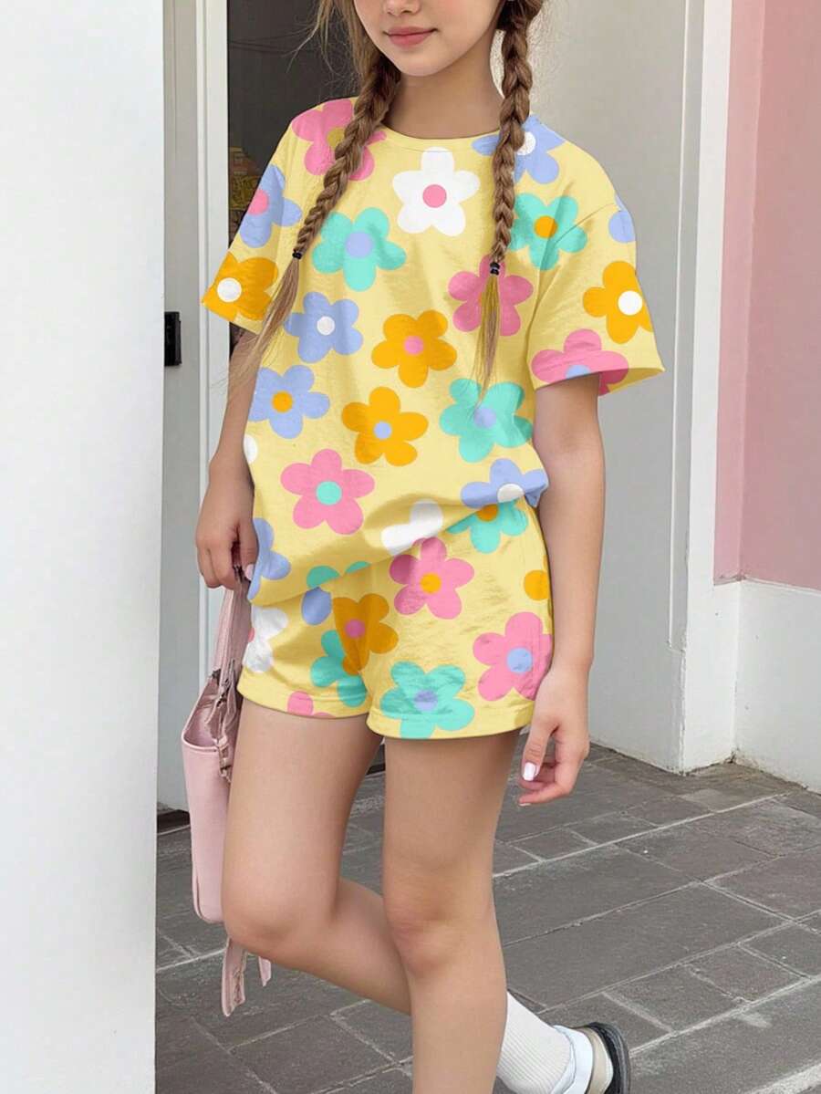 Tween girls multicolor tie-dye 2-piece outfit set featuring a drop-shoulder short-sleeve t-shirt and matching loose track shorts with side pockets.