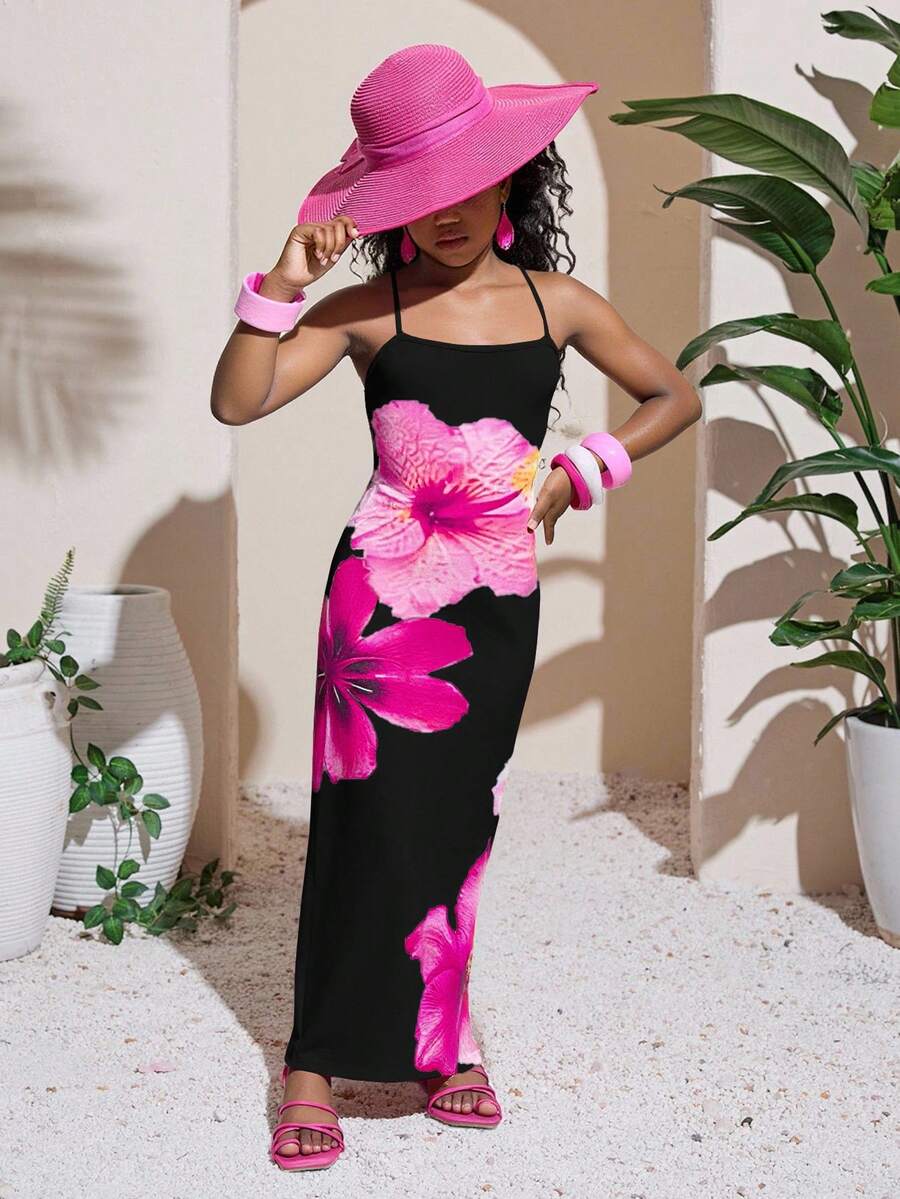 Tween girls black cami midi dress featuring plant print, spaghetti straps, slim fit, and a flared hem.