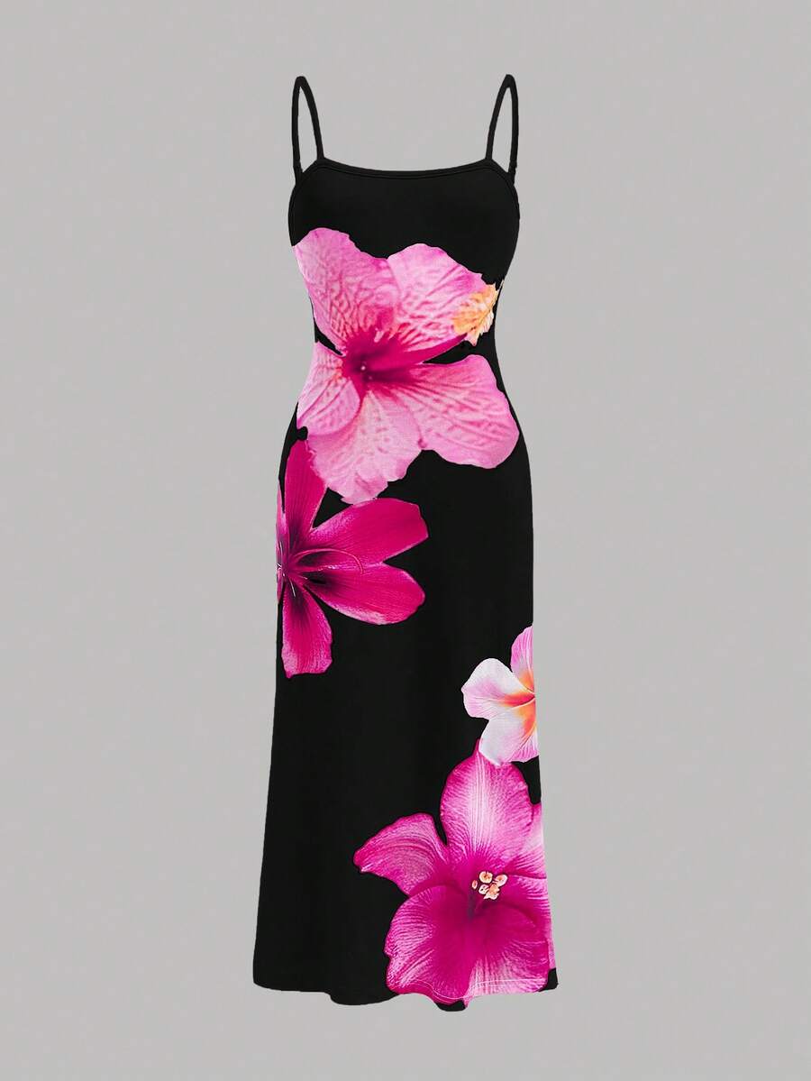 Tween girls black cami midi dress featuring plant print, spaghetti straps, slim fit, and a flared hem.
