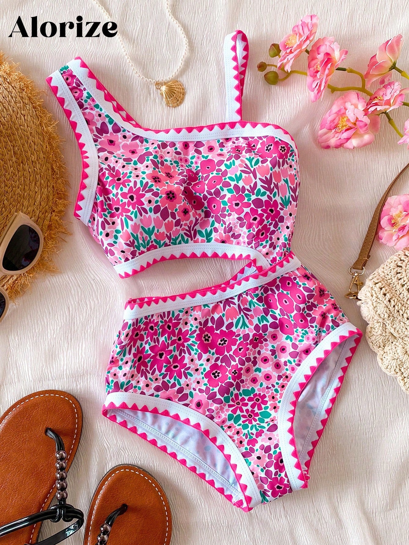Tween girls one-piece swimsuit featuring an asymmetric neckline, pendant decor, plain design, wireless bra, high-cut bottom, and medium-stretch fabric.