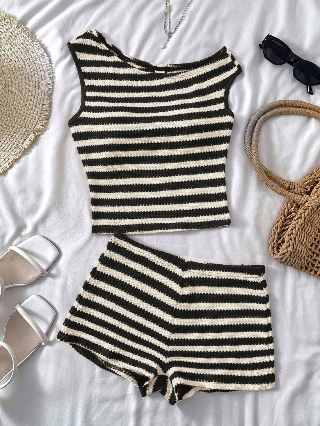 Tween girls 2-piece summer clothing set featuring a black asymmetric rib-knit striped off-shoulder t-shirt and matching slim fit shorts.