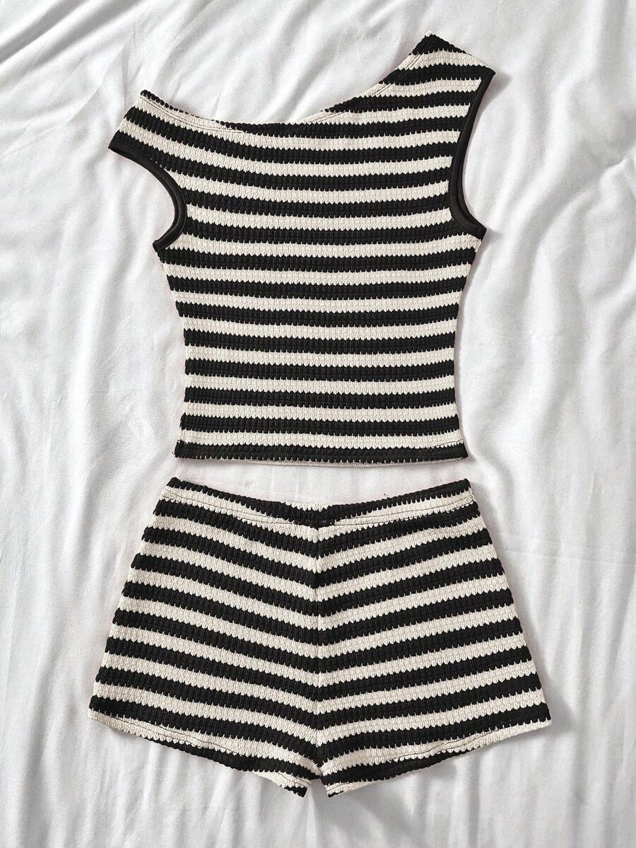Tween girls 2-piece summer clothing set featuring a black asymmetric rib-knit striped off-shoulder t-shirt and matching slim fit shorts.