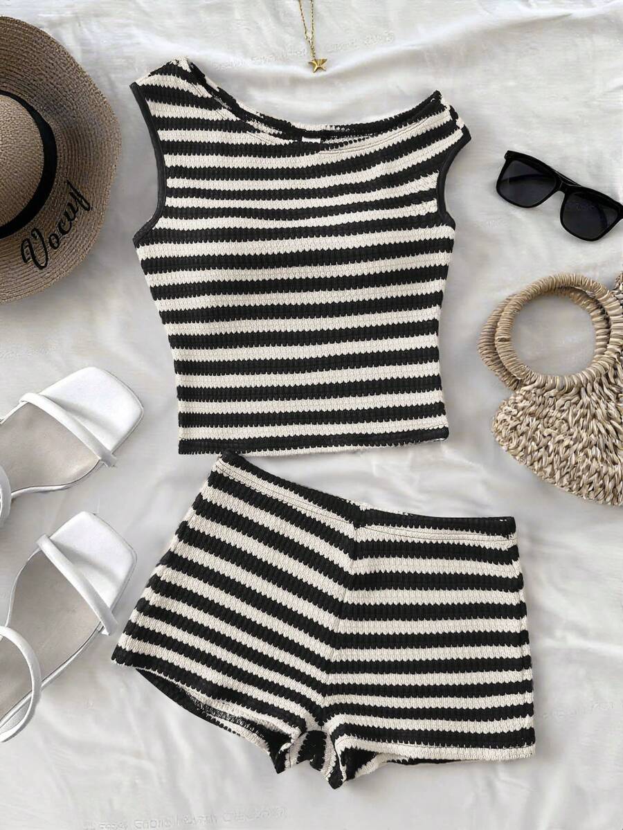 Tween girls 2-piece summer clothing set featuring a black asymmetric rib-knit striped off-shoulder t-shirt and matching slim fit shorts.