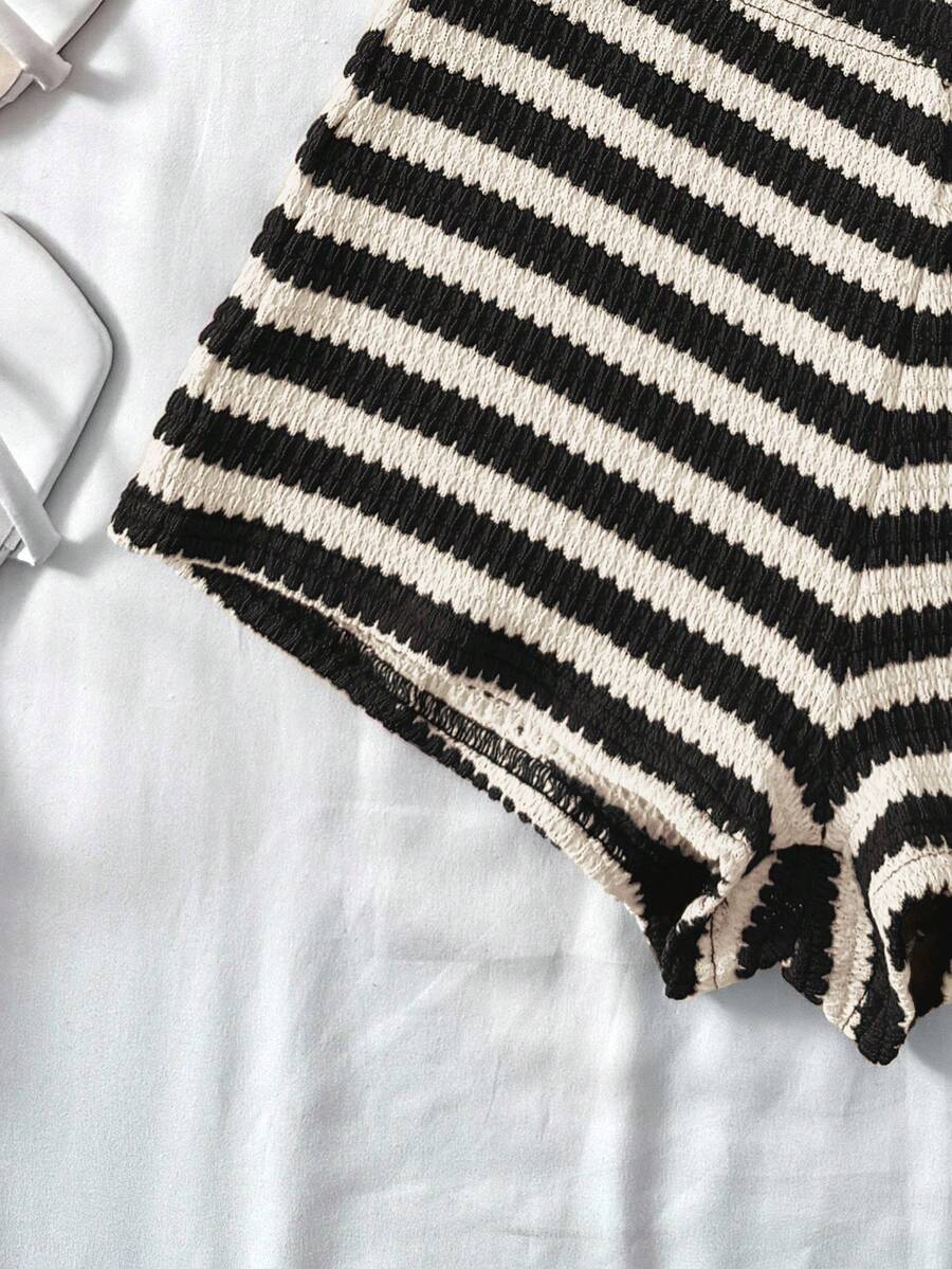 Tween girls 2-piece summer clothing set featuring a black asymmetric rib-knit striped off-shoulder t-shirt and matching slim fit shorts.