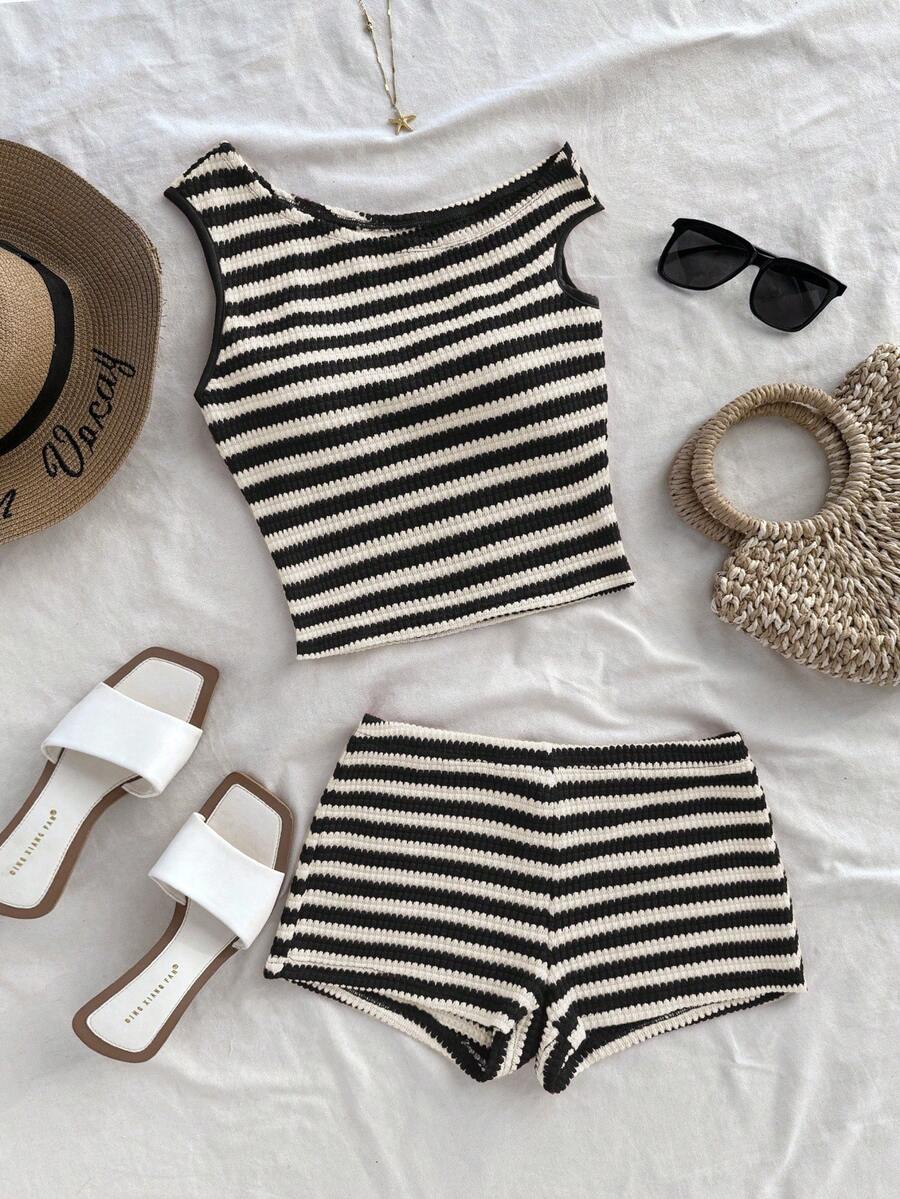 Tween girls 2-piece summer clothing set featuring a black asymmetric rib-knit striped off-shoulder t-shirt and matching slim fit shorts.