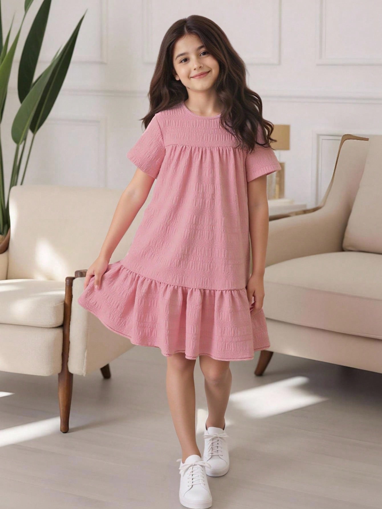 Tween girl wearing an Army Green textured short sleeve smock midi dress with round neck and ruffle flounce hem.