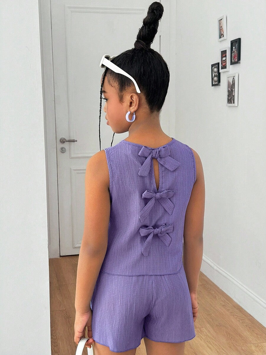 Tween girls casual blue tank top featuring round neck, textured fabric, and bow detail paired with matching shorts set.