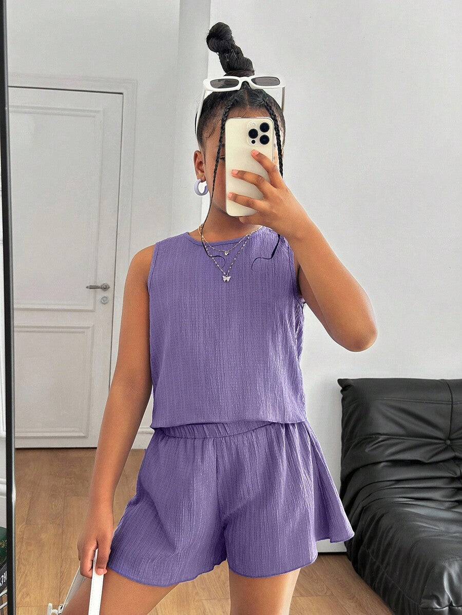Tween girls casual blue tank top featuring round neck, textured fabric, and bow detail paired with matching shorts set.