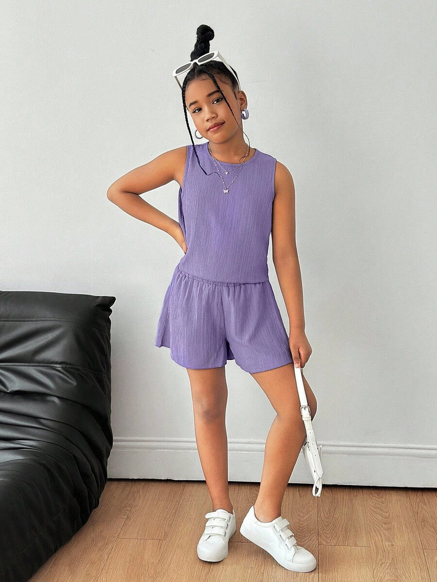 Tween girls casual blue tank top featuring round neck, textured fabric, and bow detail paired with matching shorts set.