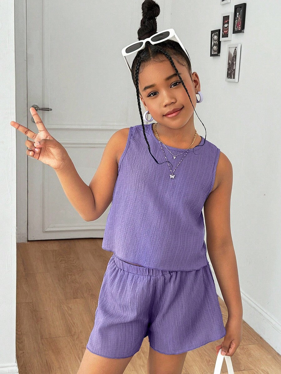 Tween girls casual blue tank top featuring round neck, textured fabric, and bow detail paired with matching shorts set.