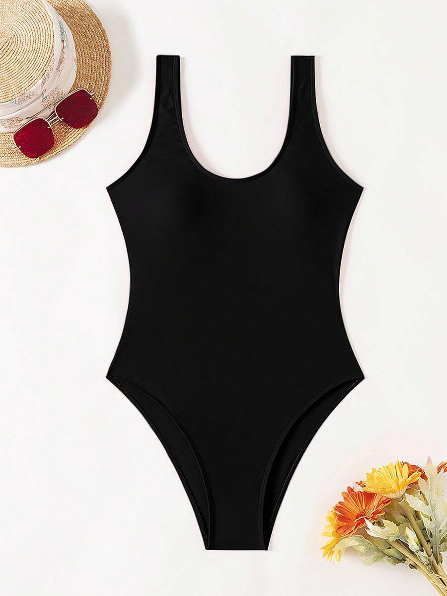 Women's solid color one-piece swimsuit featuring a backless scoop neck design and high cut fit