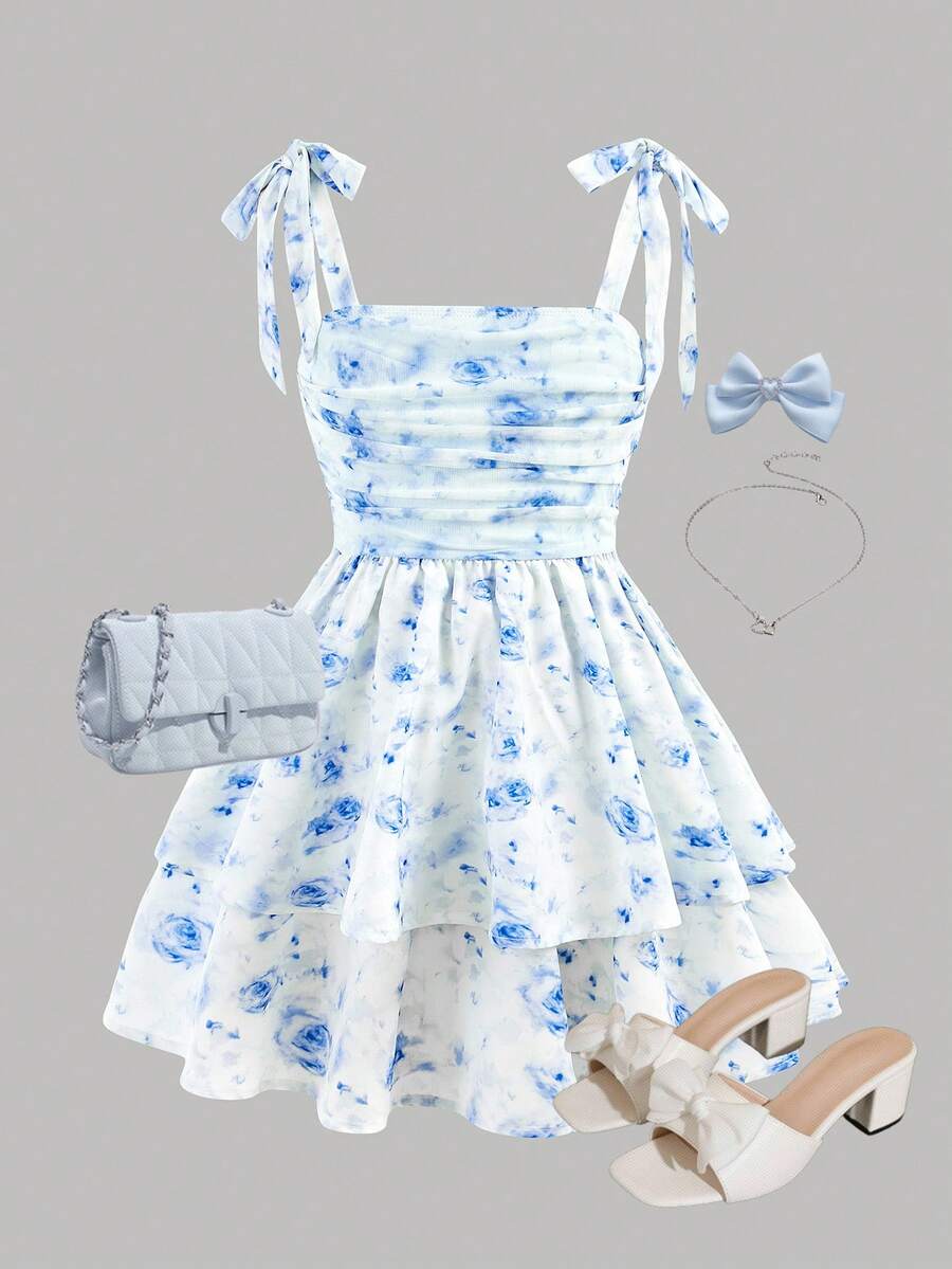 Black and white polka dot cami dress for tween girls featuring sleeveless straps, a shirred high waist, flared hem, and slim fit silhouette.