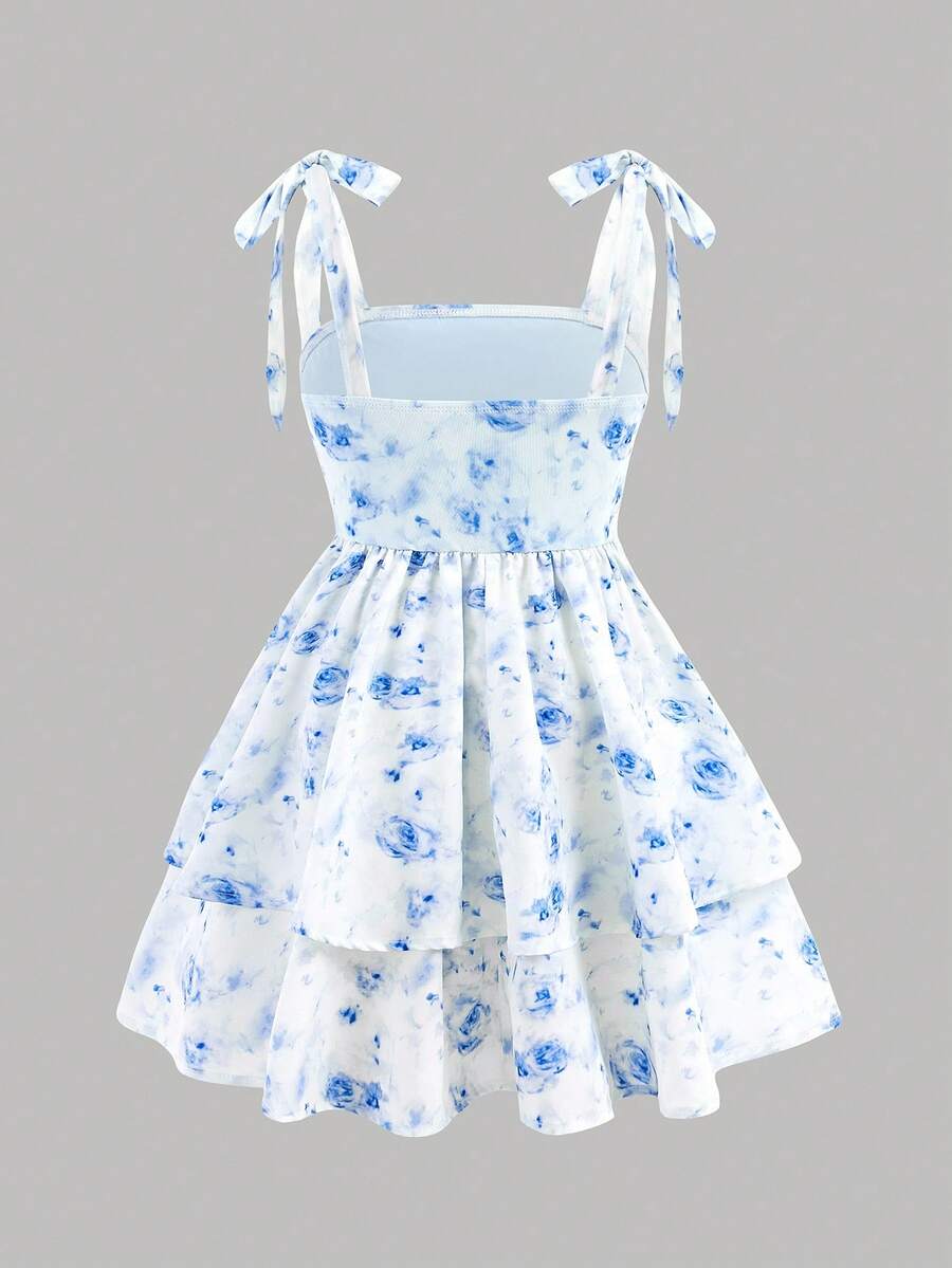 Black and white polka dot cami dress for tween girls featuring sleeveless straps, a shirred high waist, flared hem, and slim fit silhouette.