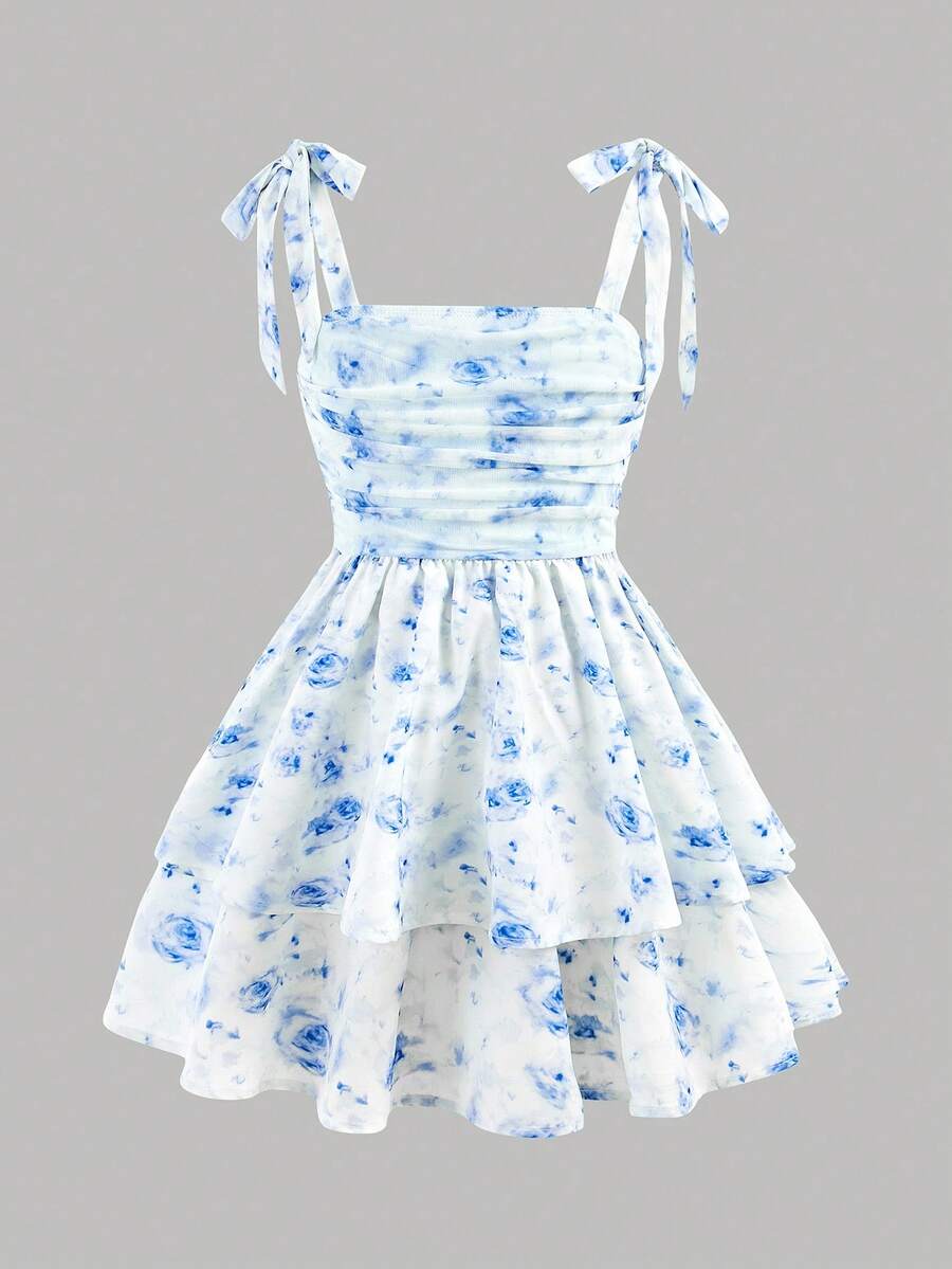Black and white polka dot cami dress for tween girls featuring sleeveless straps, a shirred high waist, flared hem, and slim fit silhouette.