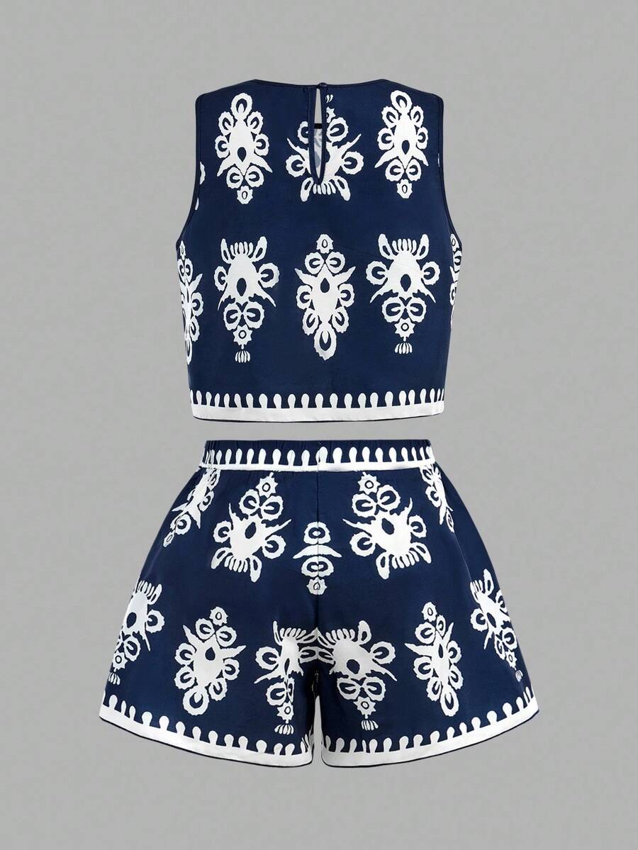 Tween girl wearing a tropical floral print two-piece vacation set featuring a sleeveless round neck tank top with button details and matching shorts.